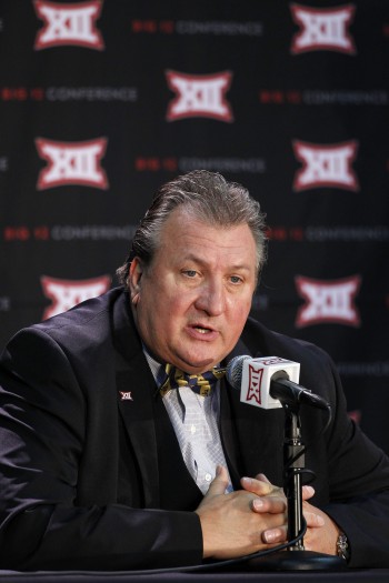 Associated Press photo from the Charleston Daily Mail West Virginia men's basketball coach Bob Huggins talks about his team's upcoming season during the Big 12 Conference Media Day at the Sprint Center in Kansas City, Mo., Wednesday.